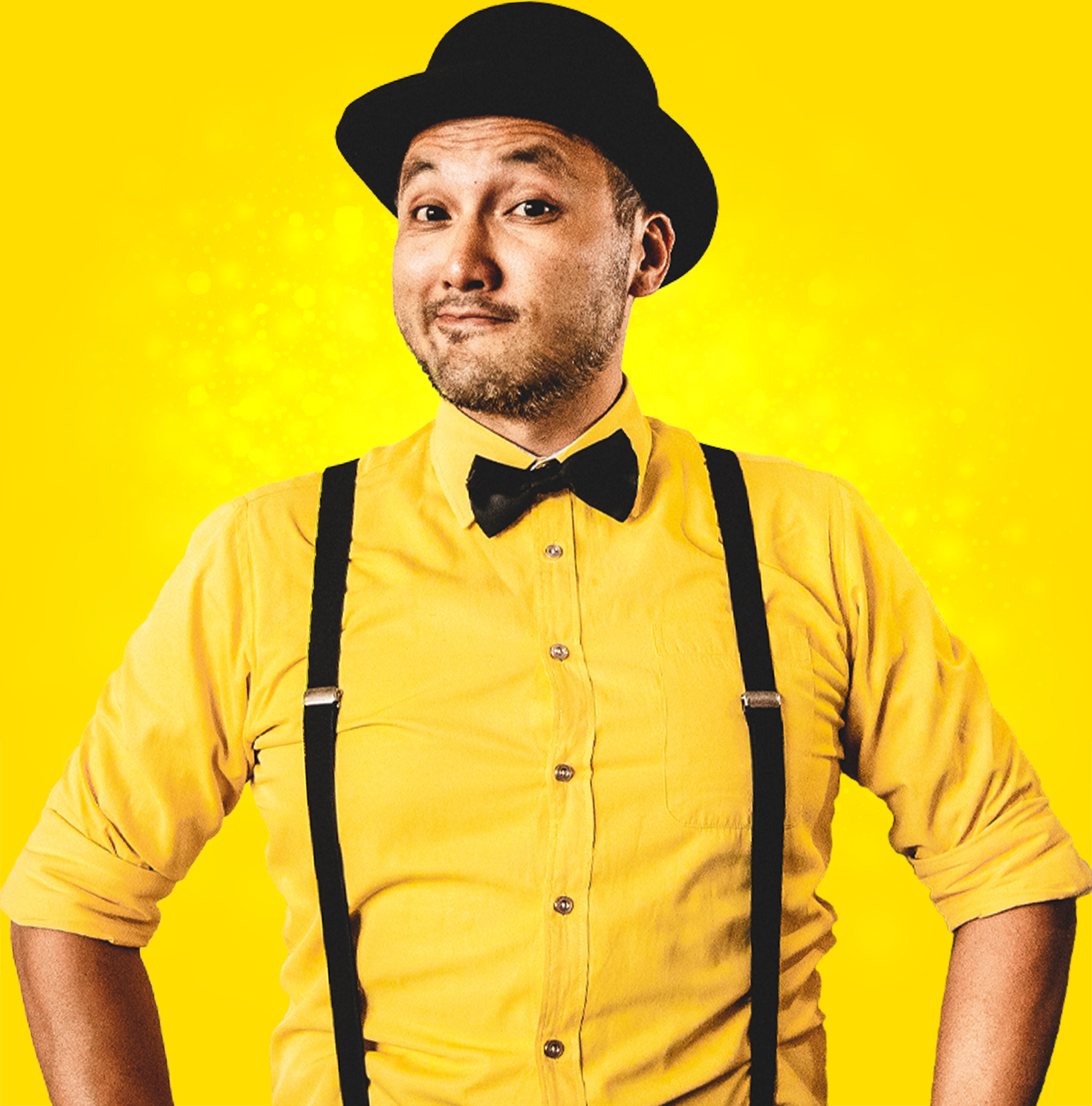 Felix Fantastic Magician in Melbourne. Magician dressed in yellow shirt with black bow tie, bowler hat and suspenders